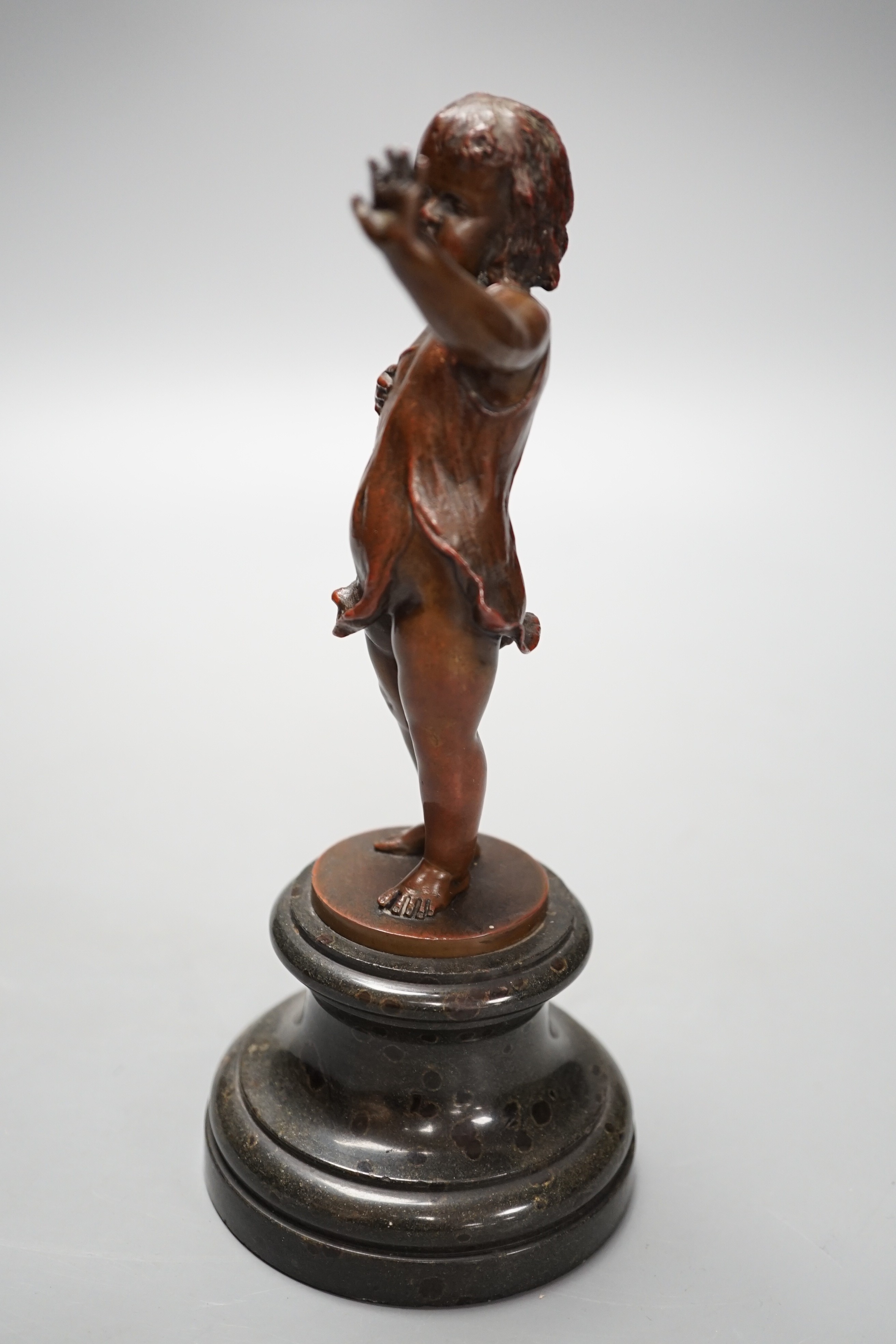 Franz Iffland (German, 1862-1935), bronze of a child holding a Punch puppet, dated 1886 20cm